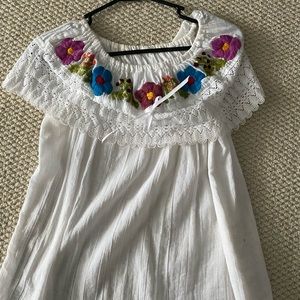 Cute white Mexican blouse with flowers on it